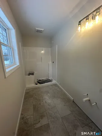 a view of an empty room with a window