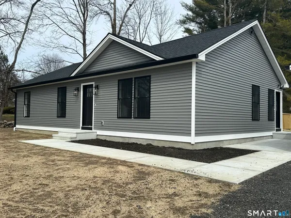 a house with trees in the background