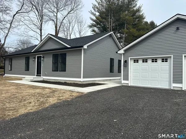 a house with trees in the background