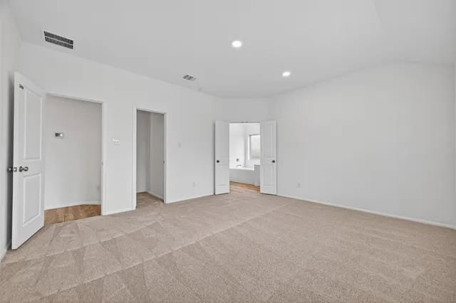 a view of a house with a backyard and a garden