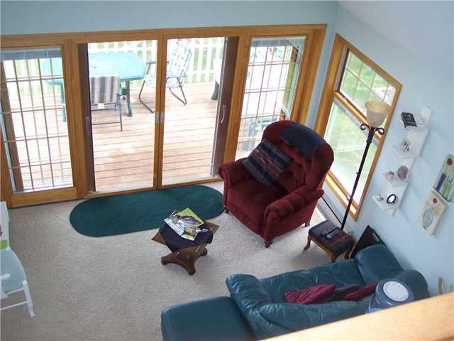 8216 Graves Point Road Huron, NY 14590 - Photo 4 of 16 Living Room Looking down from the loft at the Livi