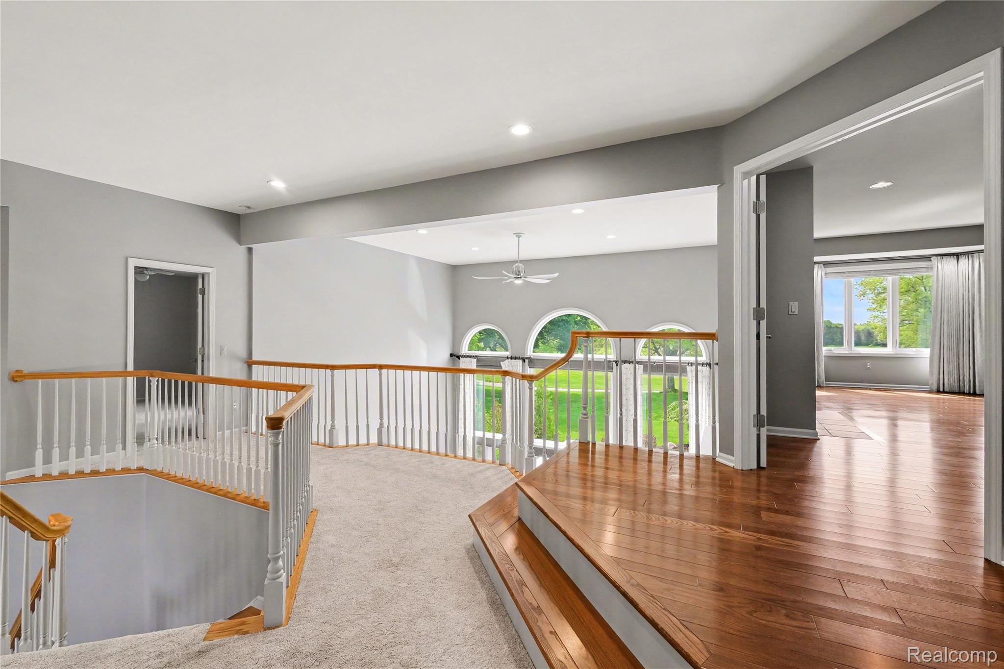 4179 St Andrews Street Howell, MI 48843 - Photo 40 of 75 Corridor featuring recessed lighting, an upstairs landing, and light wood-style flooring