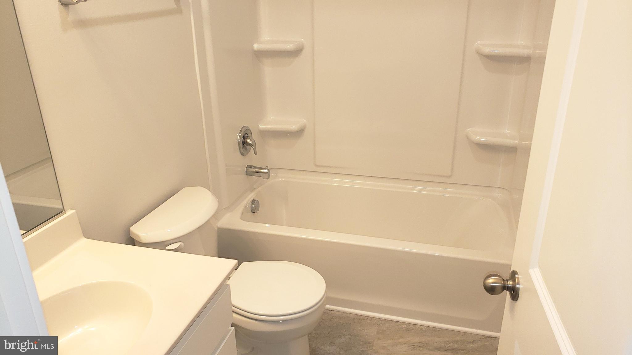 214 Case Road Townsend, DE 19734 - Photo 8 of 18 a bathroom with a sink a toilet and bathtub