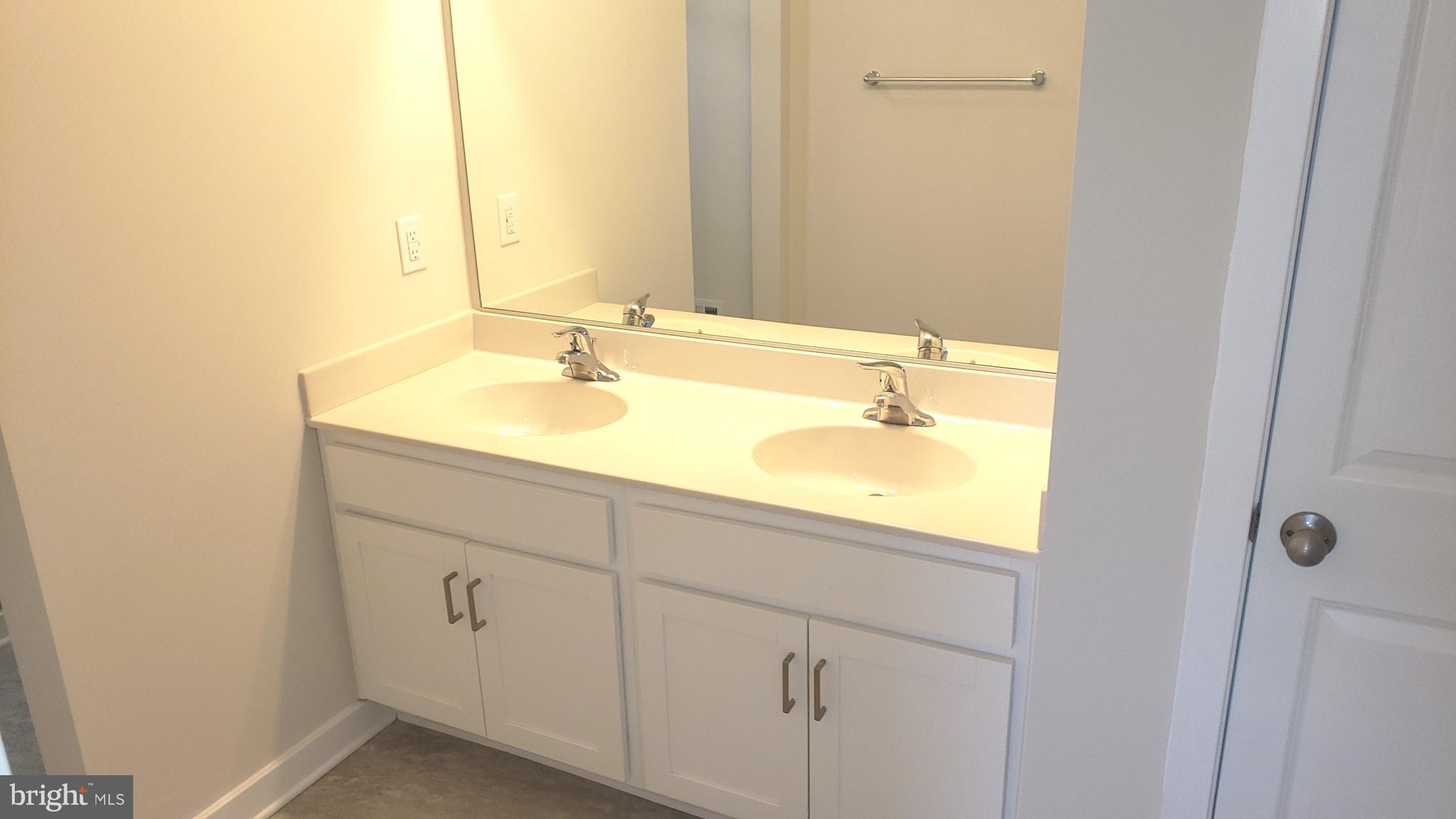 214 Case Road Townsend, DE 19734 - Photo 9 of 18 a bathroom with a sink and a mirror