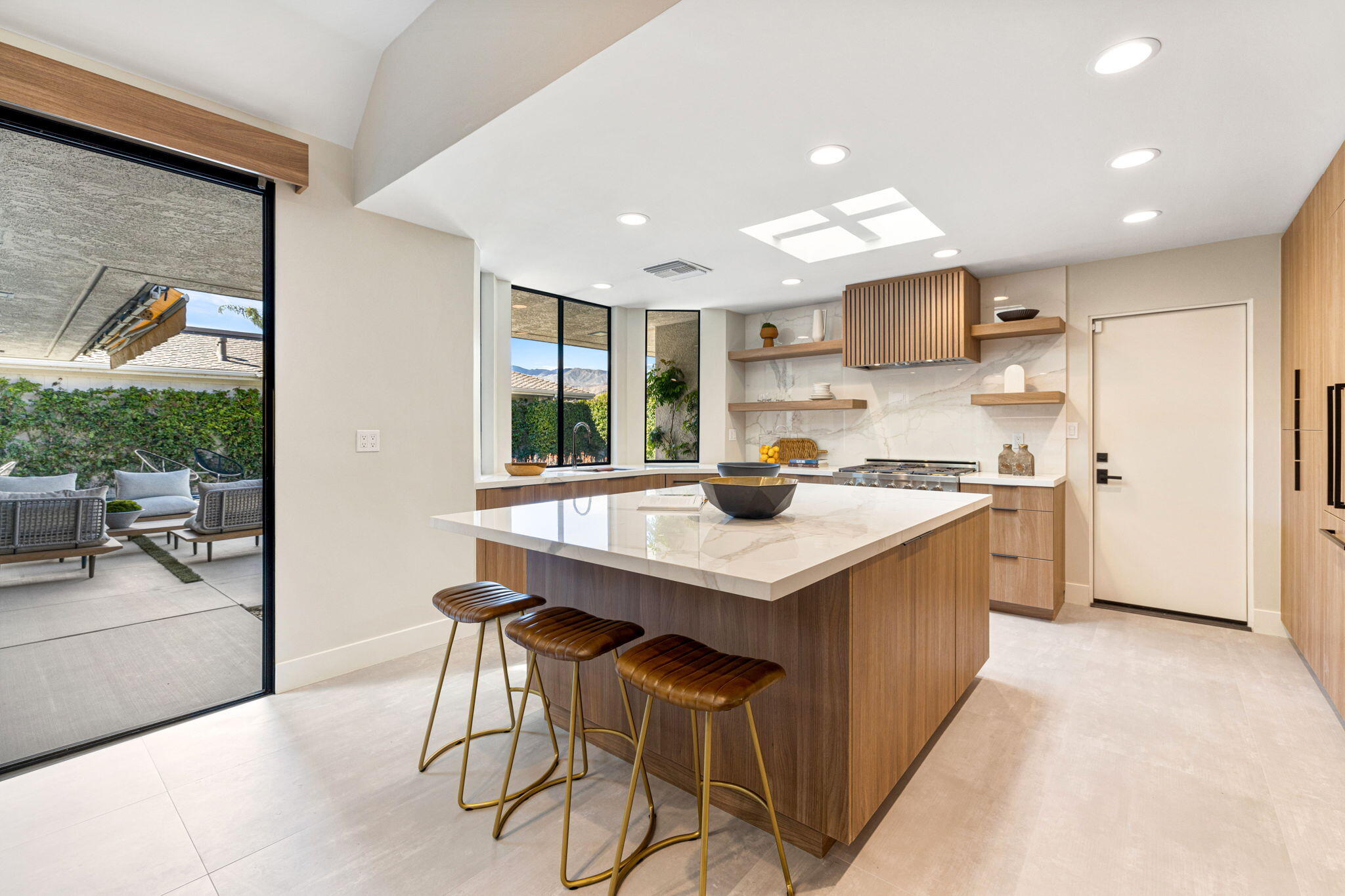 27 Colgate Drive Rancho Mirage, CA 92270 - Photo 20 of 87 a kitchen with a sink a center island cabinets and appliances