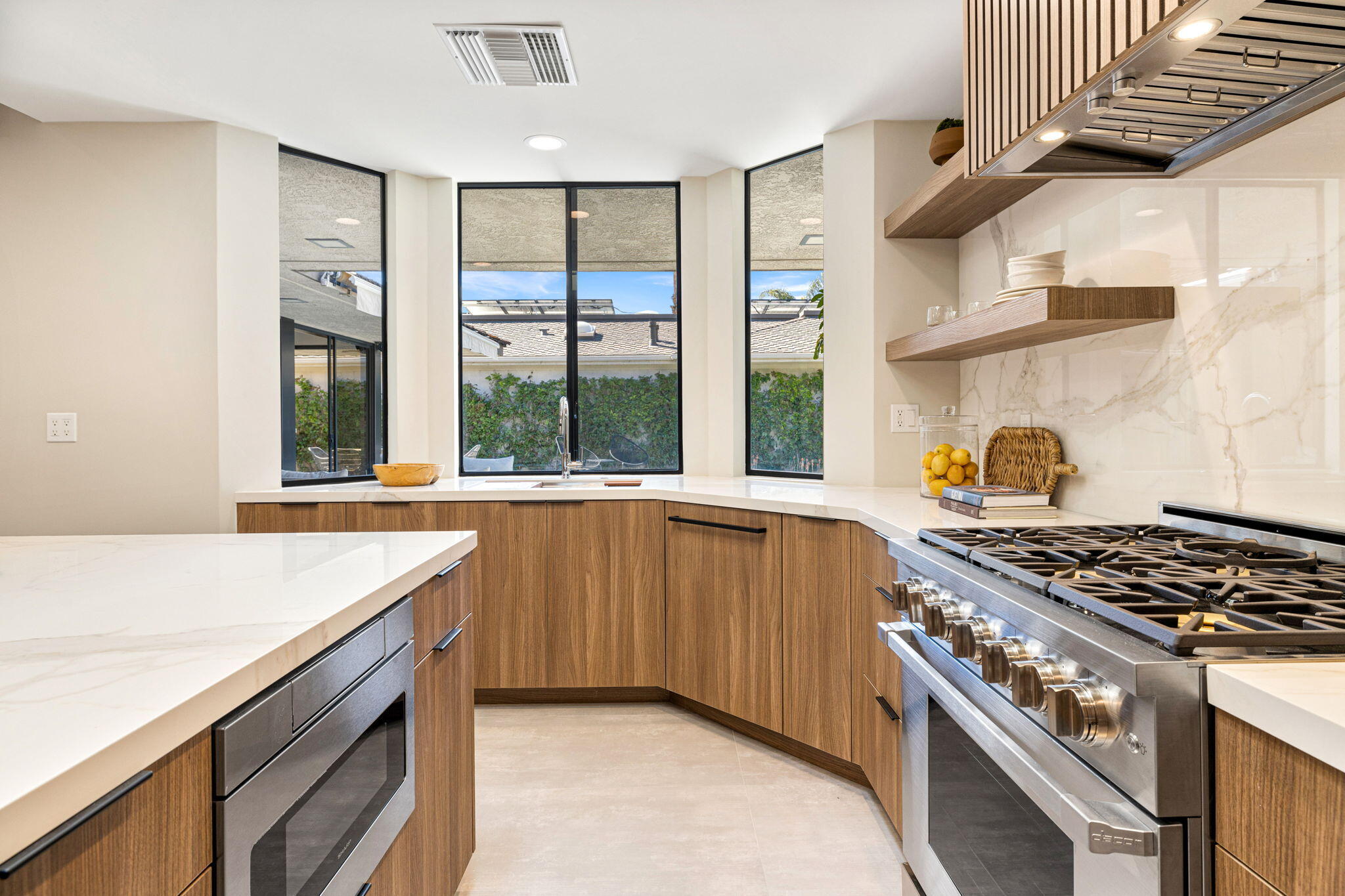27 Colgate Drive Rancho Mirage, CA 92270 - Photo 27 of 87 a kitchen filled with stainless steel appliances granite countertop a stove and a sink
