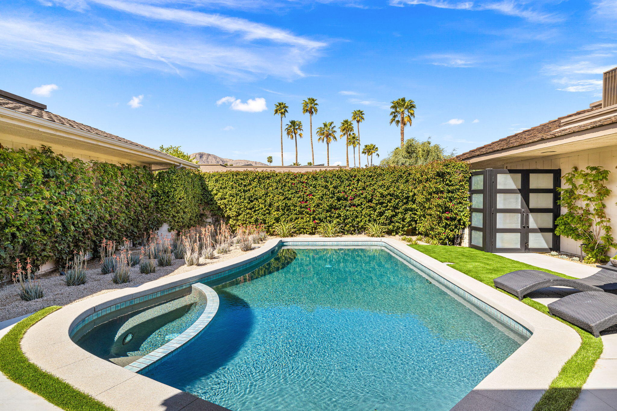 27 Colgate Drive Rancho Mirage, CA 92270 - Photo 53 of 87 a view of a swimming pool with a yard