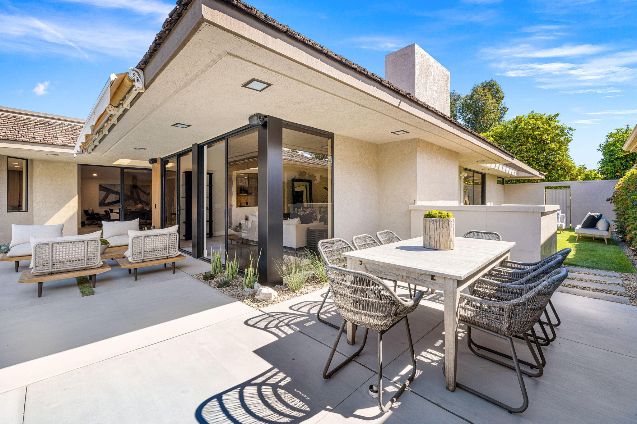 27 Colgate Drive Rancho Mirage, CA 92270 - Photo 55 of 87 a view of a patio with table and chairs and potted plants