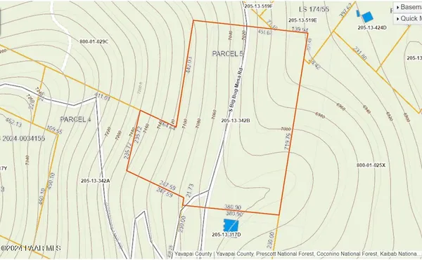 a white house with shower wooden floor
