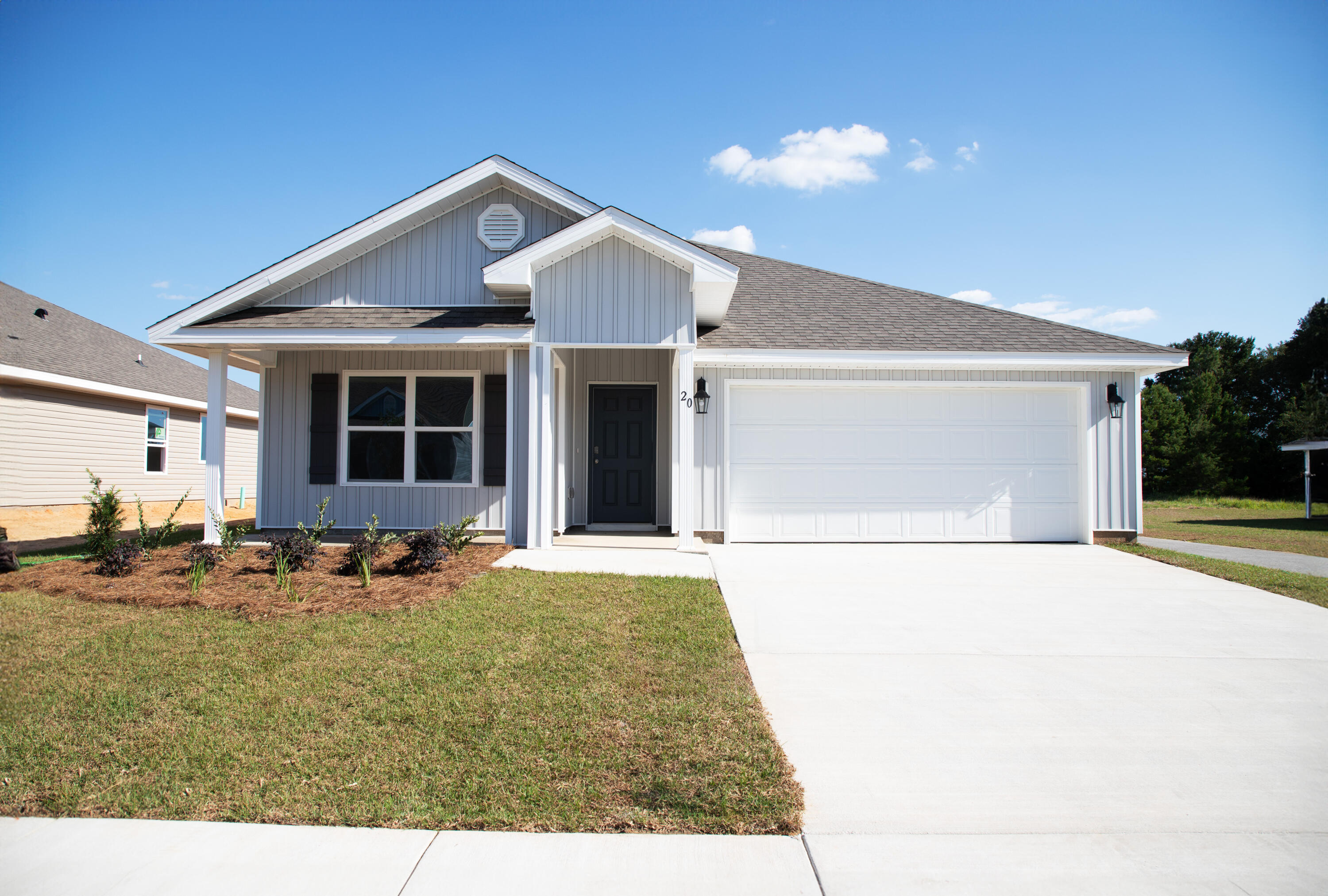 20 Bluebeech Street Freeport, FL 32439 - Photo 1 of 26 a front view of a house with patio