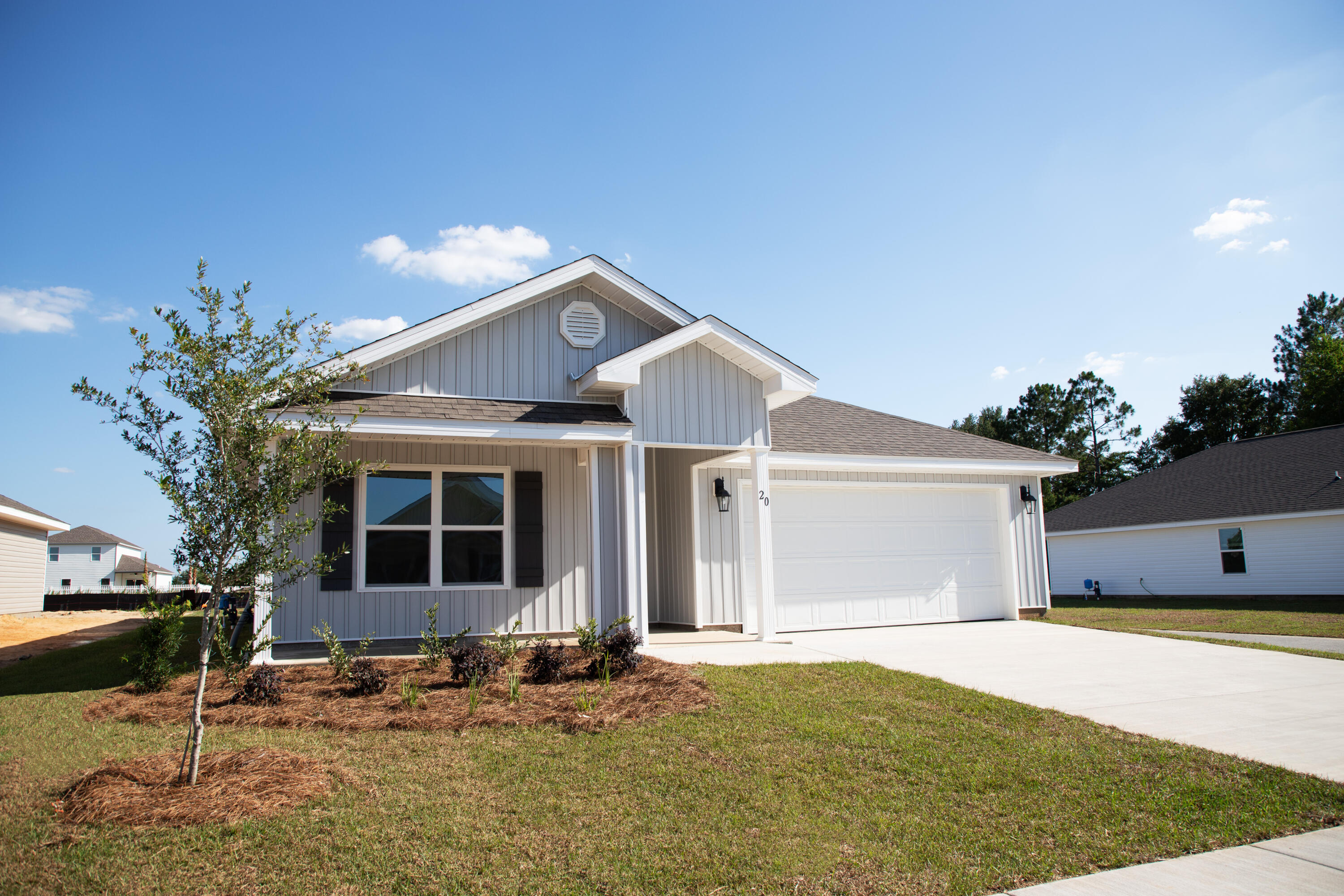20 Bluebeech Street Freeport, FL 32439 - Photo 2 of 26 a front view of a house with garden