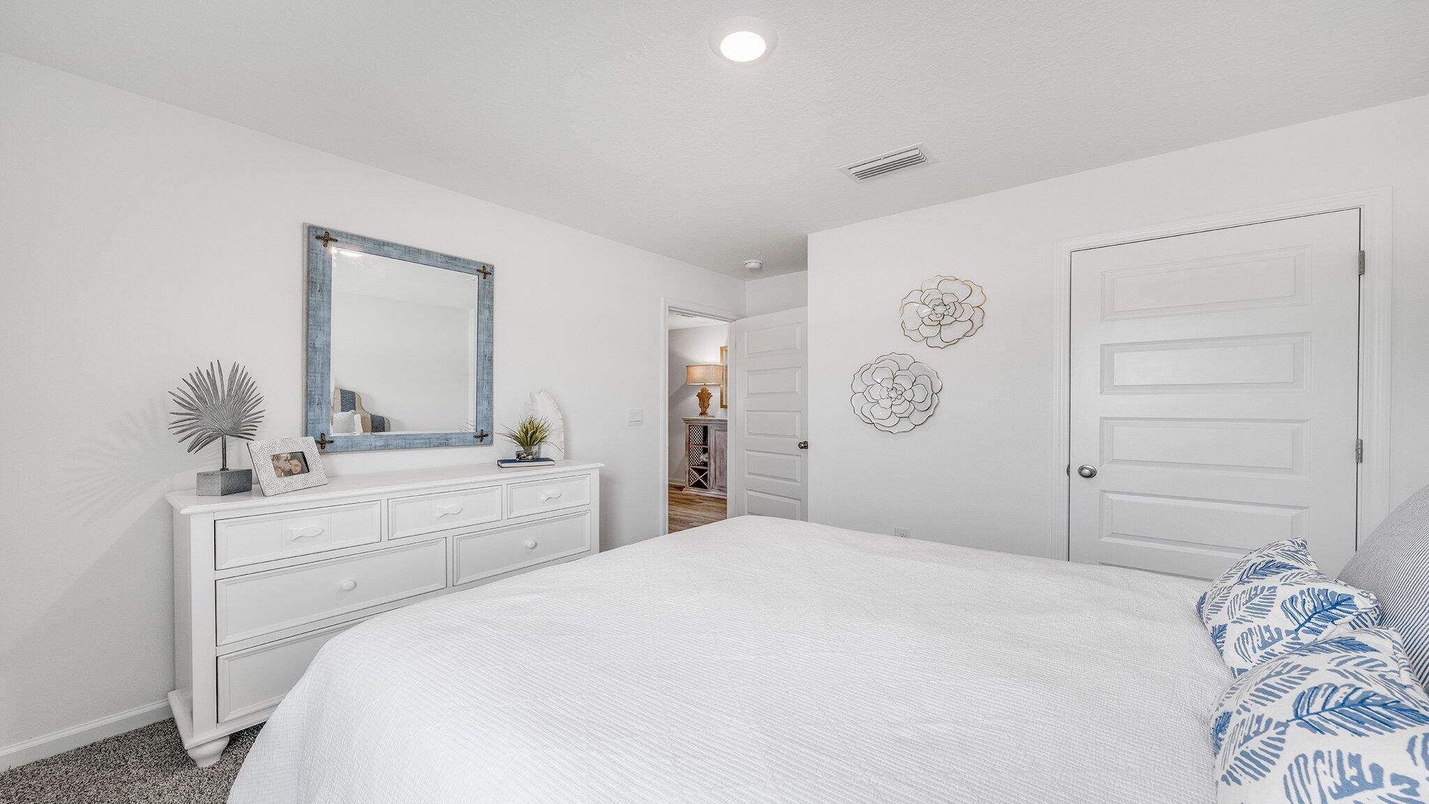 20 Bluebeech Street Freeport, FL 32439 - Photo 21 of 26 a bedroom with a bed and a window