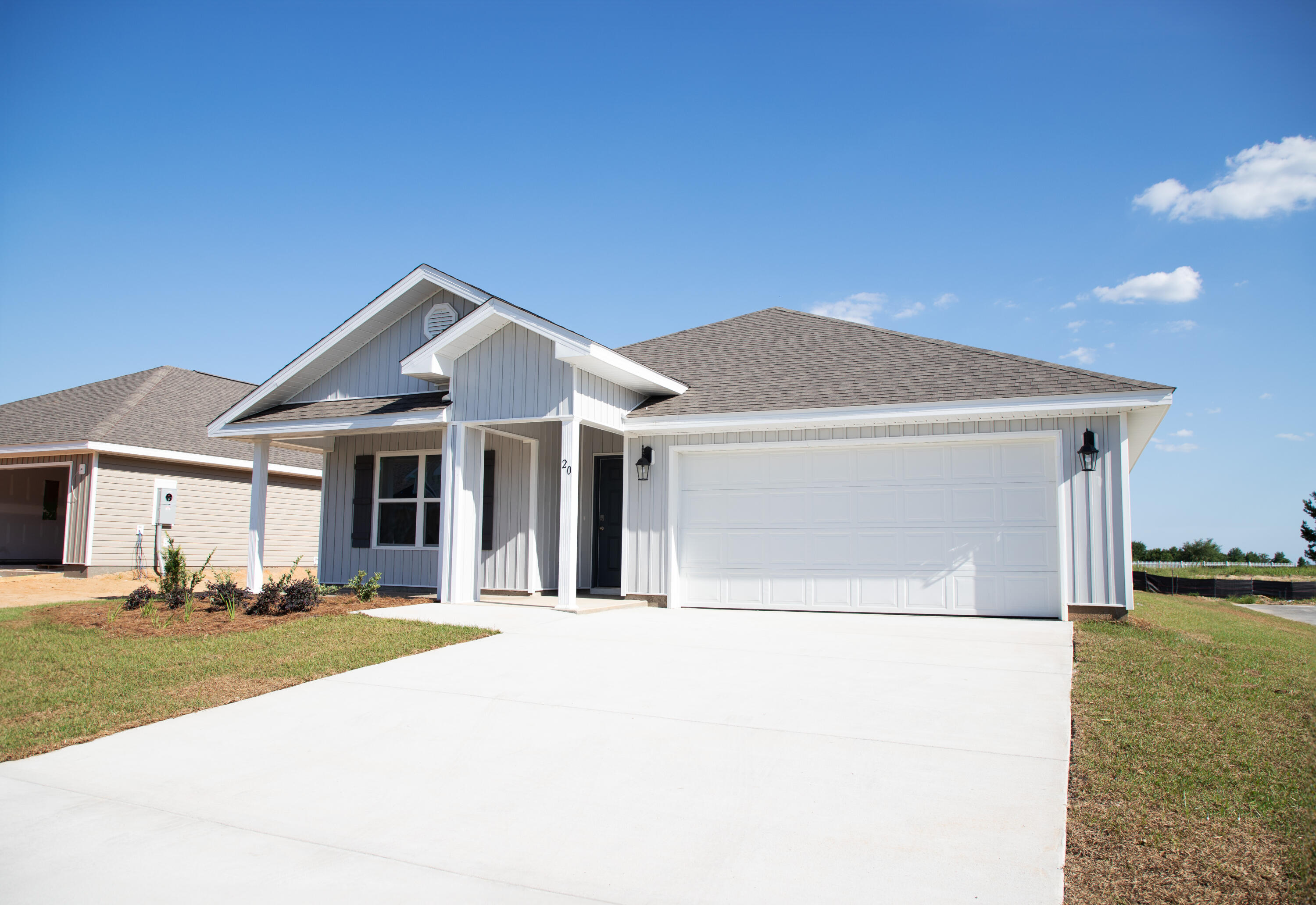 20 Bluebeech Street Freeport, FL 32439 - Photo 26 of 26 a front view of a house with a yard