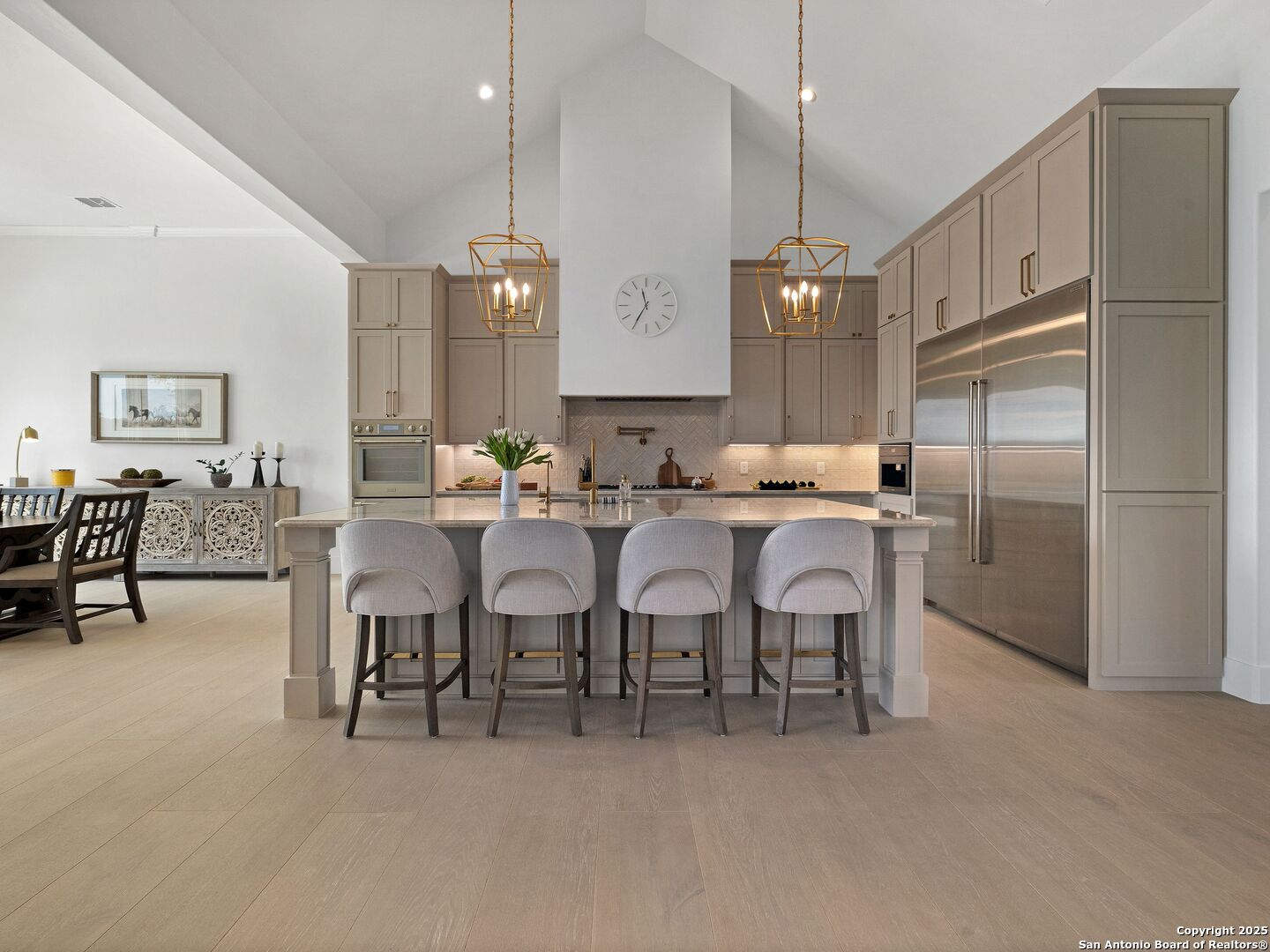 137 Phillip Ranch Road Boerne, TX 78006 - Photo 14 of 61 a large kitchen with a table chairs refrigerator and cabinets