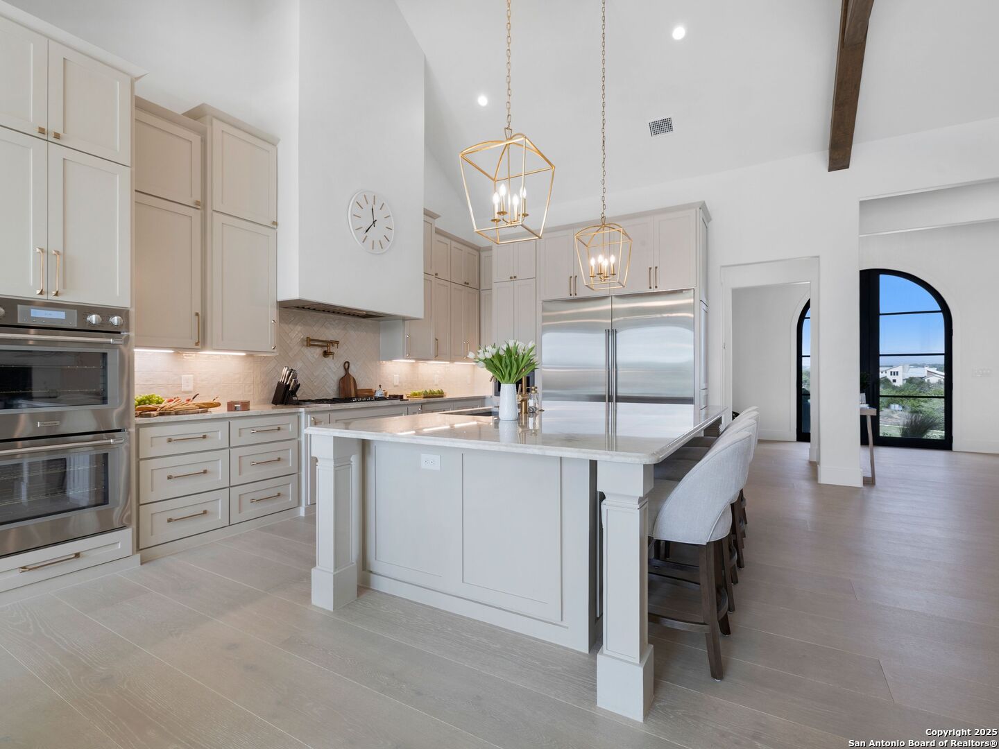 137 Phillip Ranch Road Boerne, TX 78006 - Photo 20 of 61 a kitchen with white cabinets and stainless steel appliances