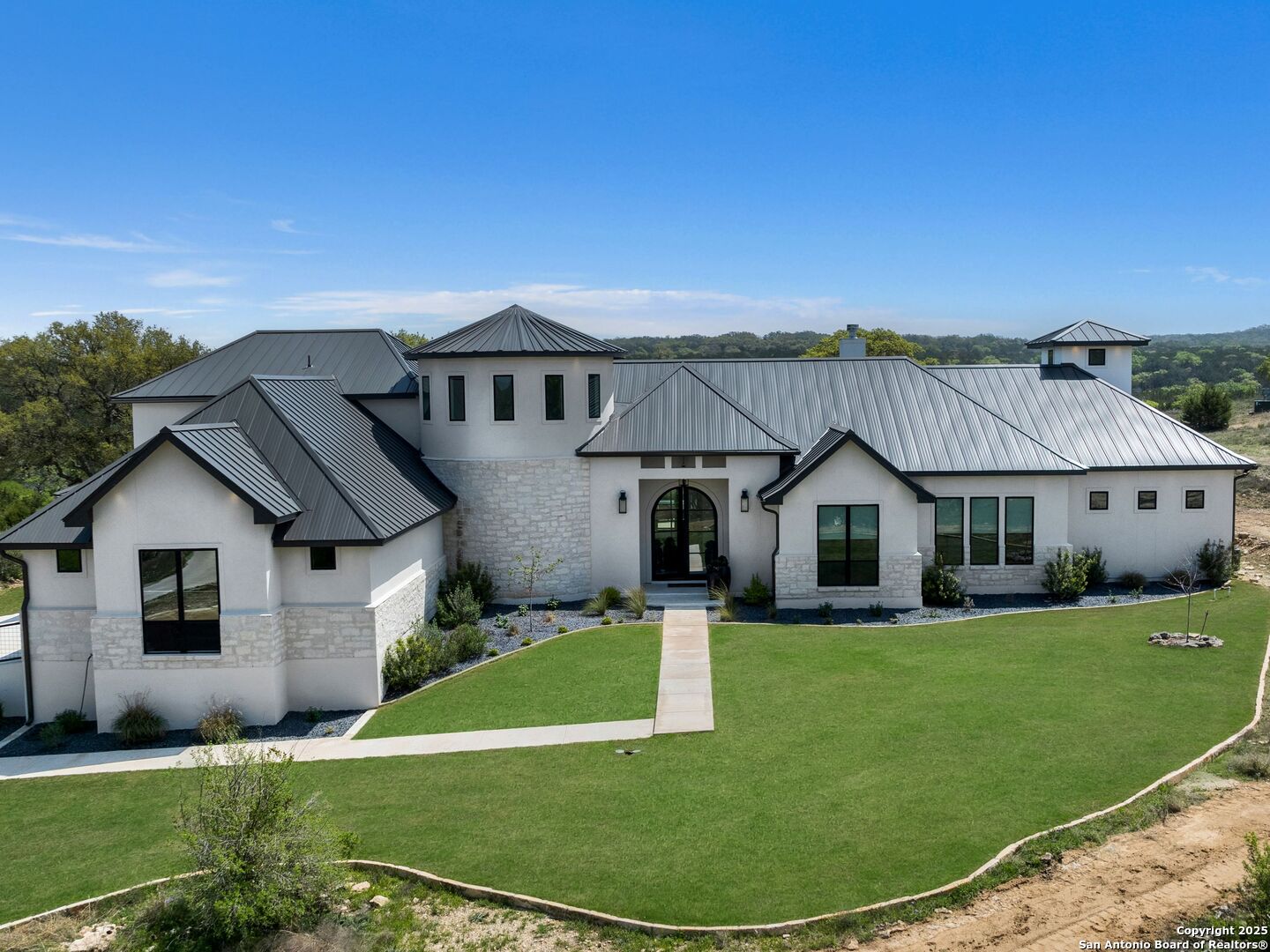 137 Phillip Ranch Road Boerne, TX 78006 - Photo 2 of 61 a view of a house with a big yard potted plants and large trees
