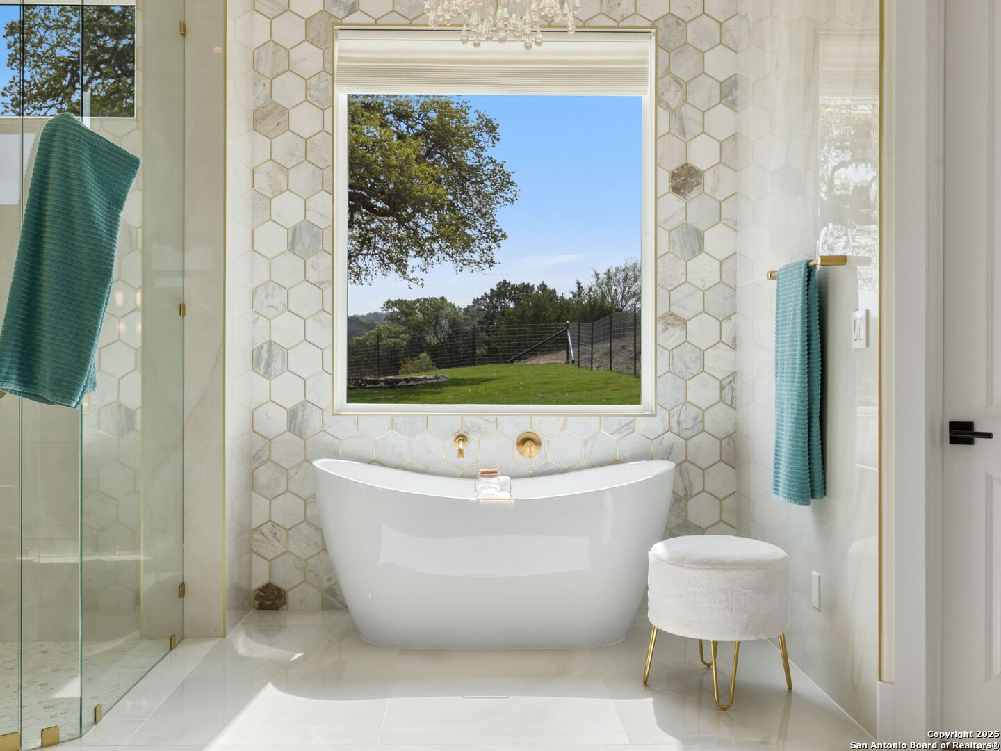 137 Phillip Ranch Road Boerne, TX 78006 - Photo 25 of 61 a bathroom with a bathtub and shower