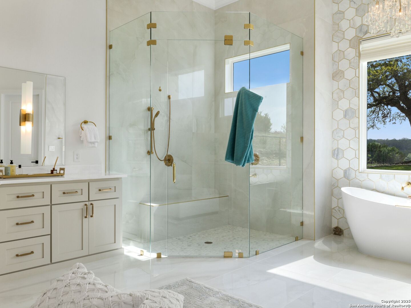 137 Phillip Ranch Road Boerne, TX 78006 - Photo 27 of 61 a bathroom with a shower sink and mirror