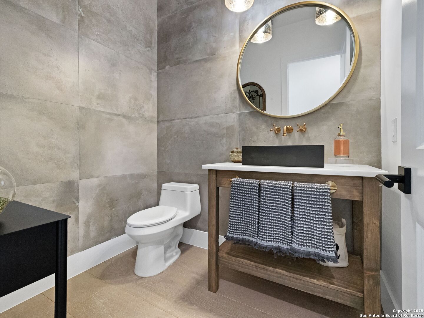 137 Phillip Ranch Road Boerne, TX 78006 - Photo 30 of 61 a bathroom with a toilet and a mirror