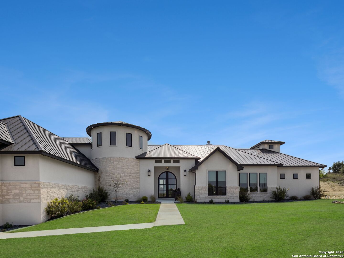 137 Phillip Ranch Road Boerne, TX 78006 - Photo 3 of 61 a front view of a house with a yard and garage