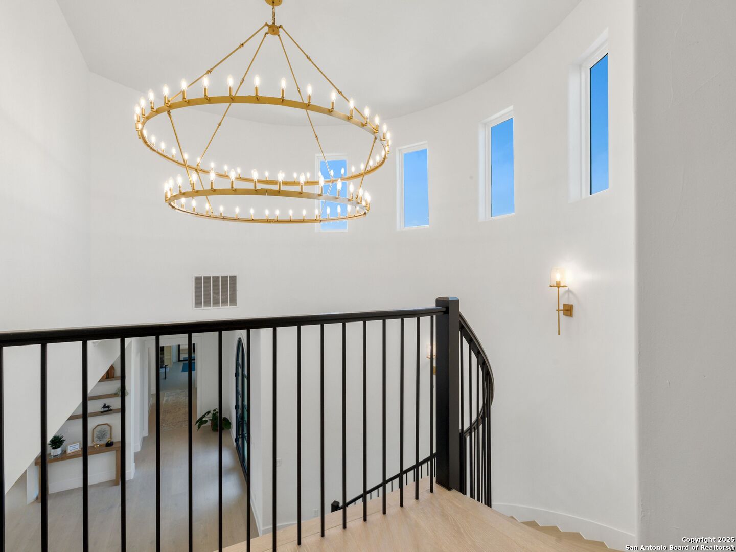 137 Phillip Ranch Road Boerne, TX 78006 - Photo 36 of 61 a view of staircase with railing and a chandelier