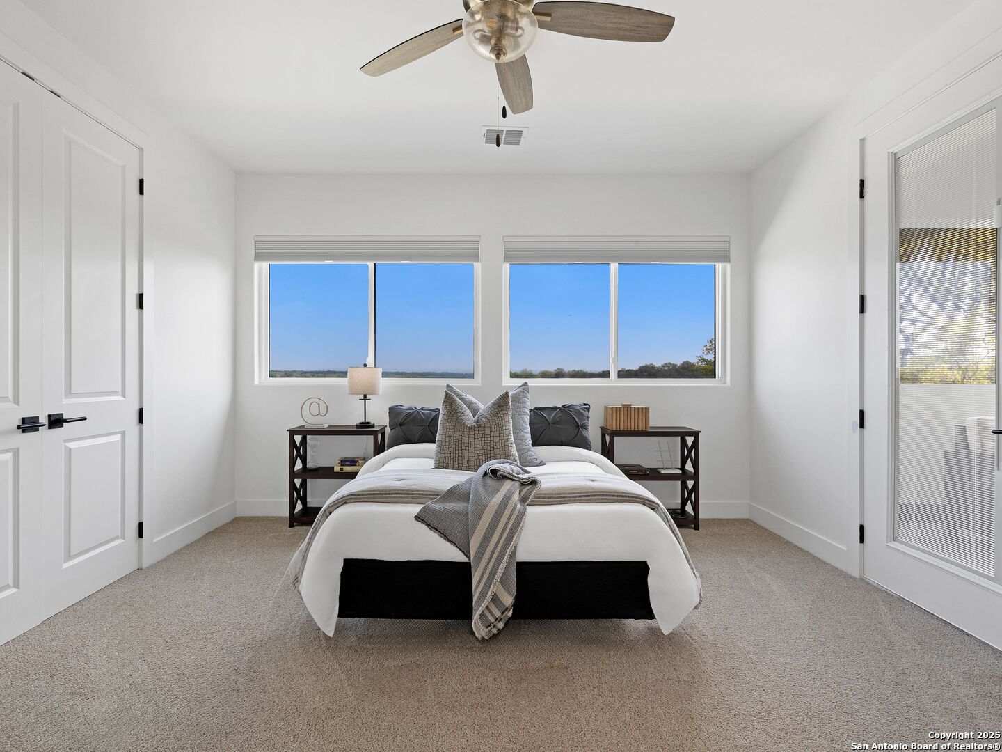 137 Phillip Ranch Road Boerne, TX 78006 - Photo 38 of 61 a spacious bedroom with a bed a window and closet