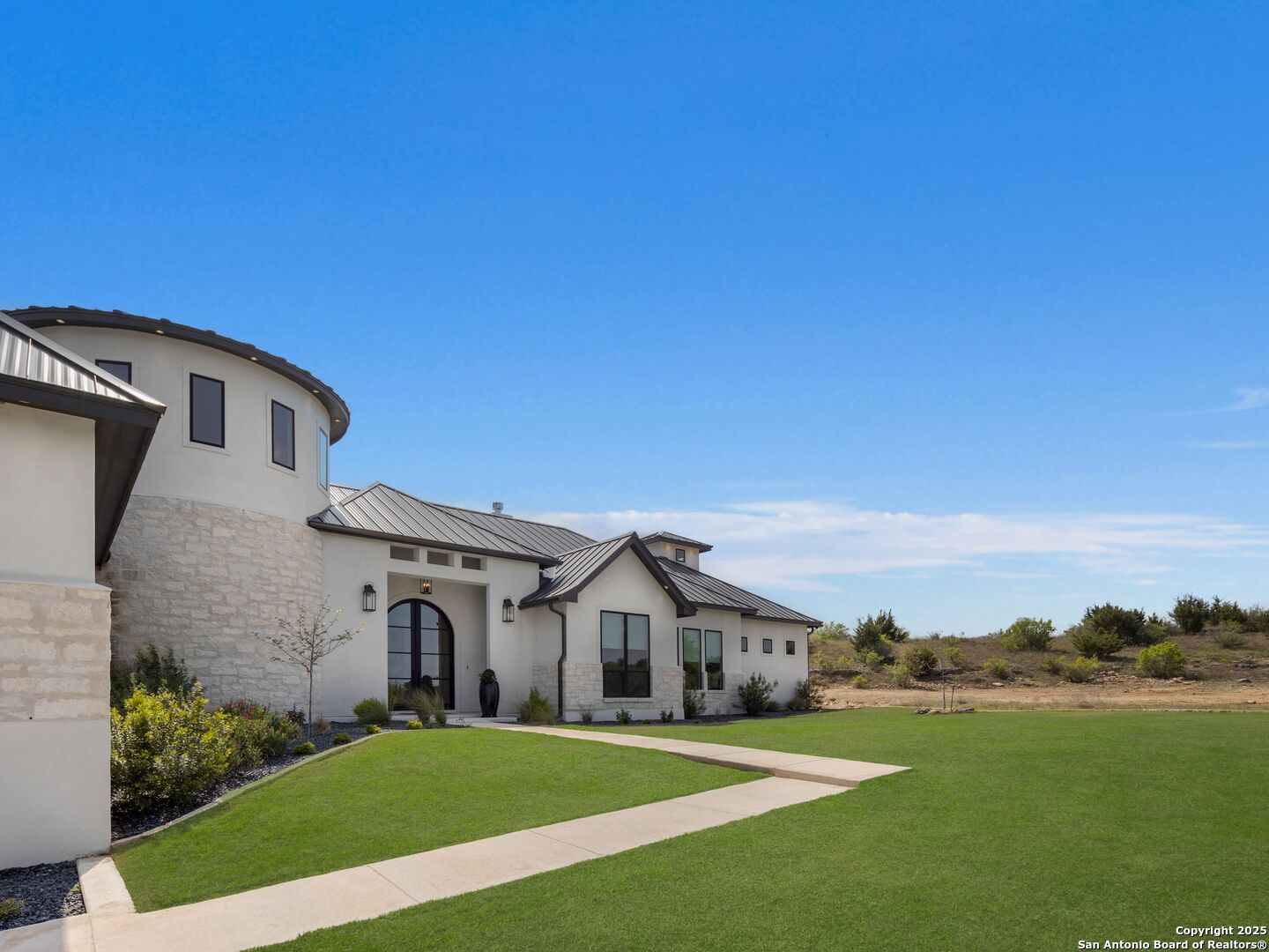 137 Phillip Ranch Road Boerne, TX 78006 - Photo 4 of 61 a front view of a house with a yard