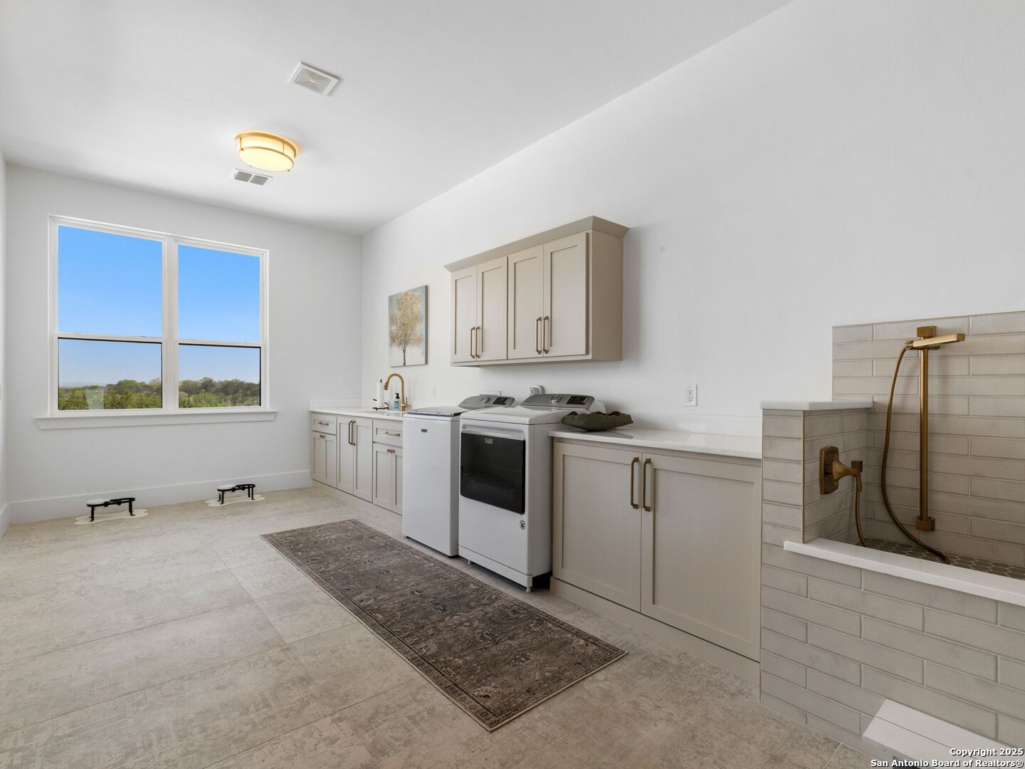 137 Phillip Ranch Road Boerne, TX 78006 - Photo 41 of 61 a kitchen with stainless steel appliances a stove a sink and a refrigerator