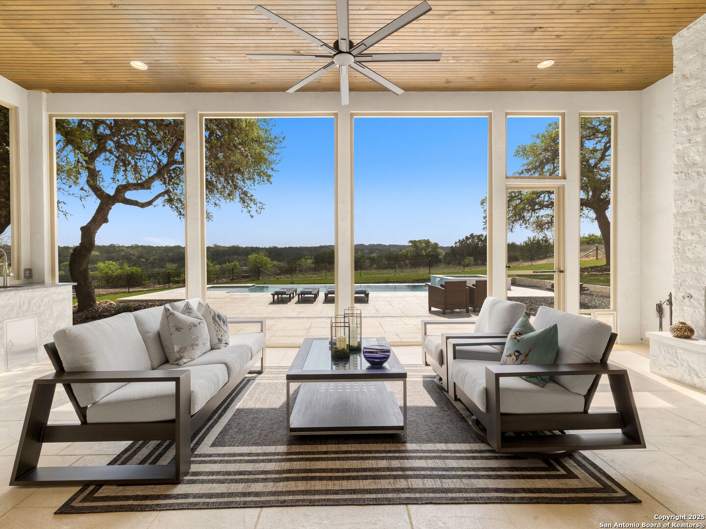 137 Phillip Ranch Road Boerne, TX 78006 - Photo 42 of 61 a living room with furniture large window and table