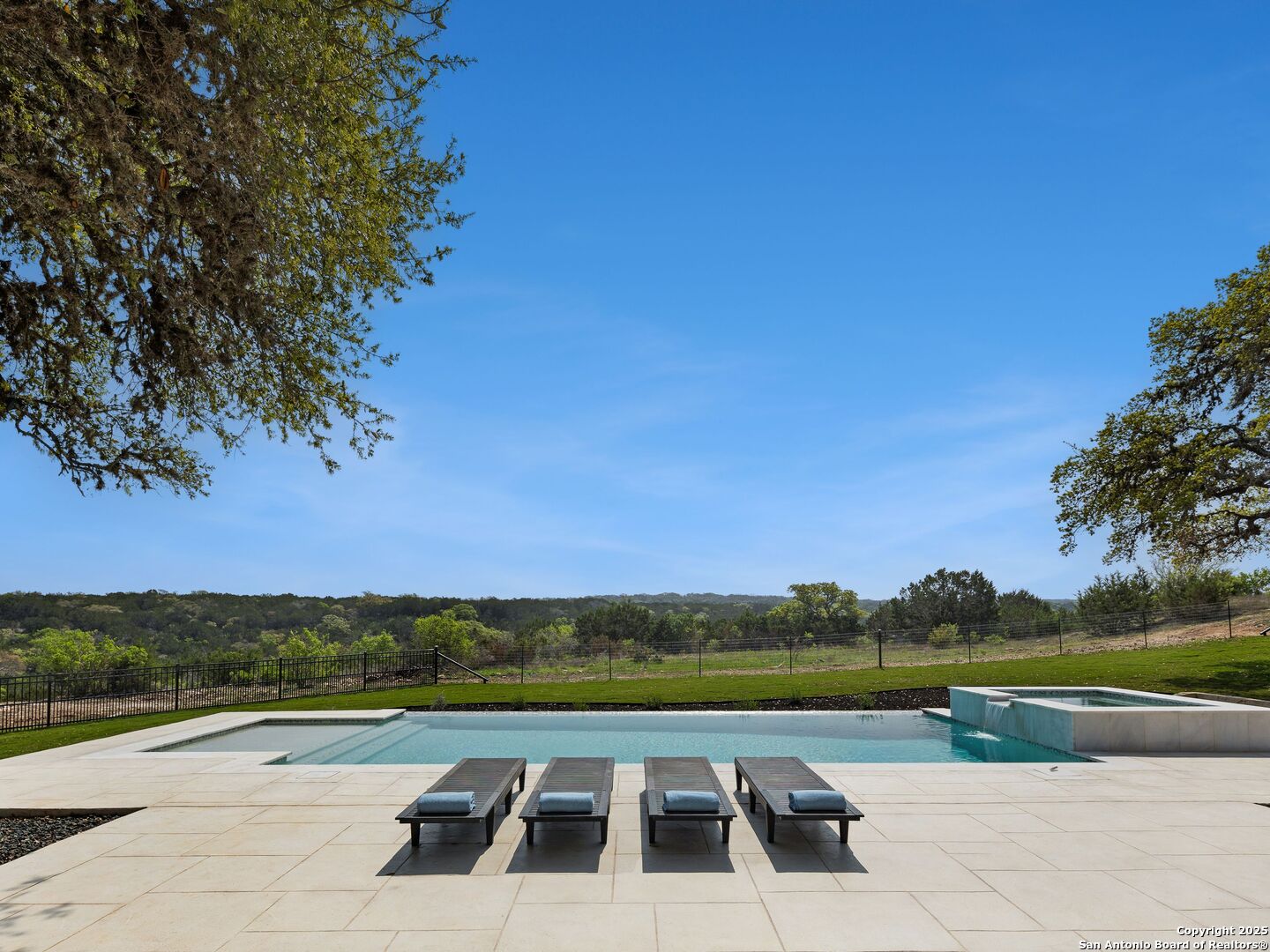 137 Phillip Ranch Road Boerne, TX 78006 - Photo 45 of 61 a view of swimming pool with lake and mountain view