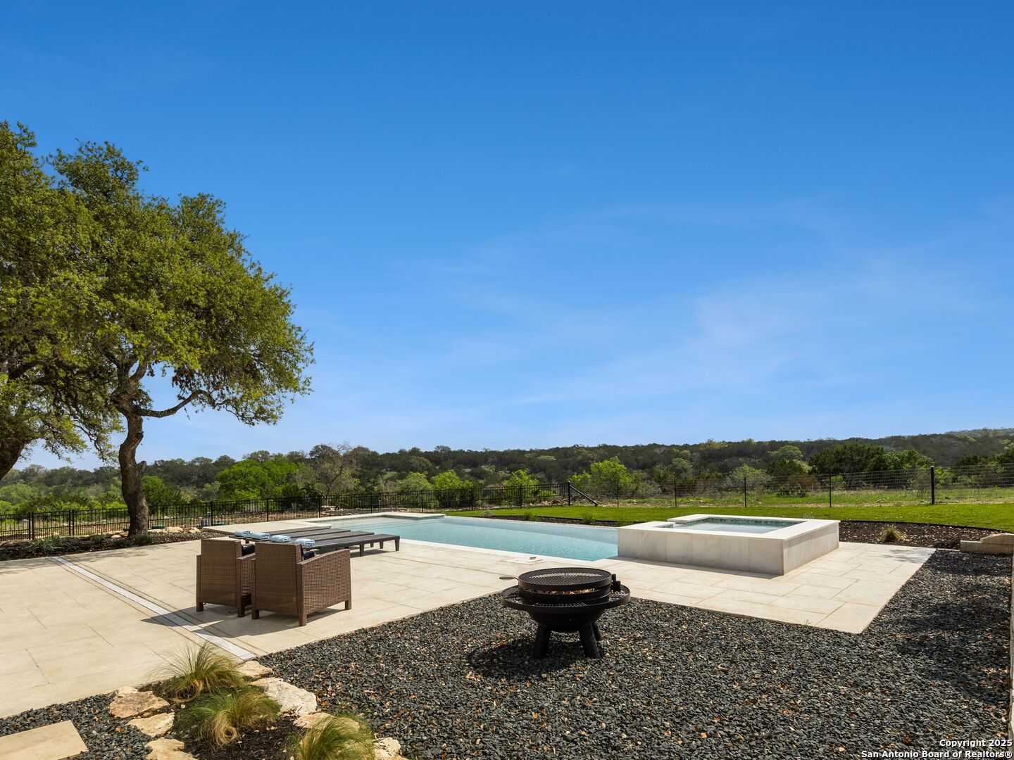 137 Phillip Ranch Road Boerne, TX 78006 - Photo 46 of 61 a view of a lake with couches and city view