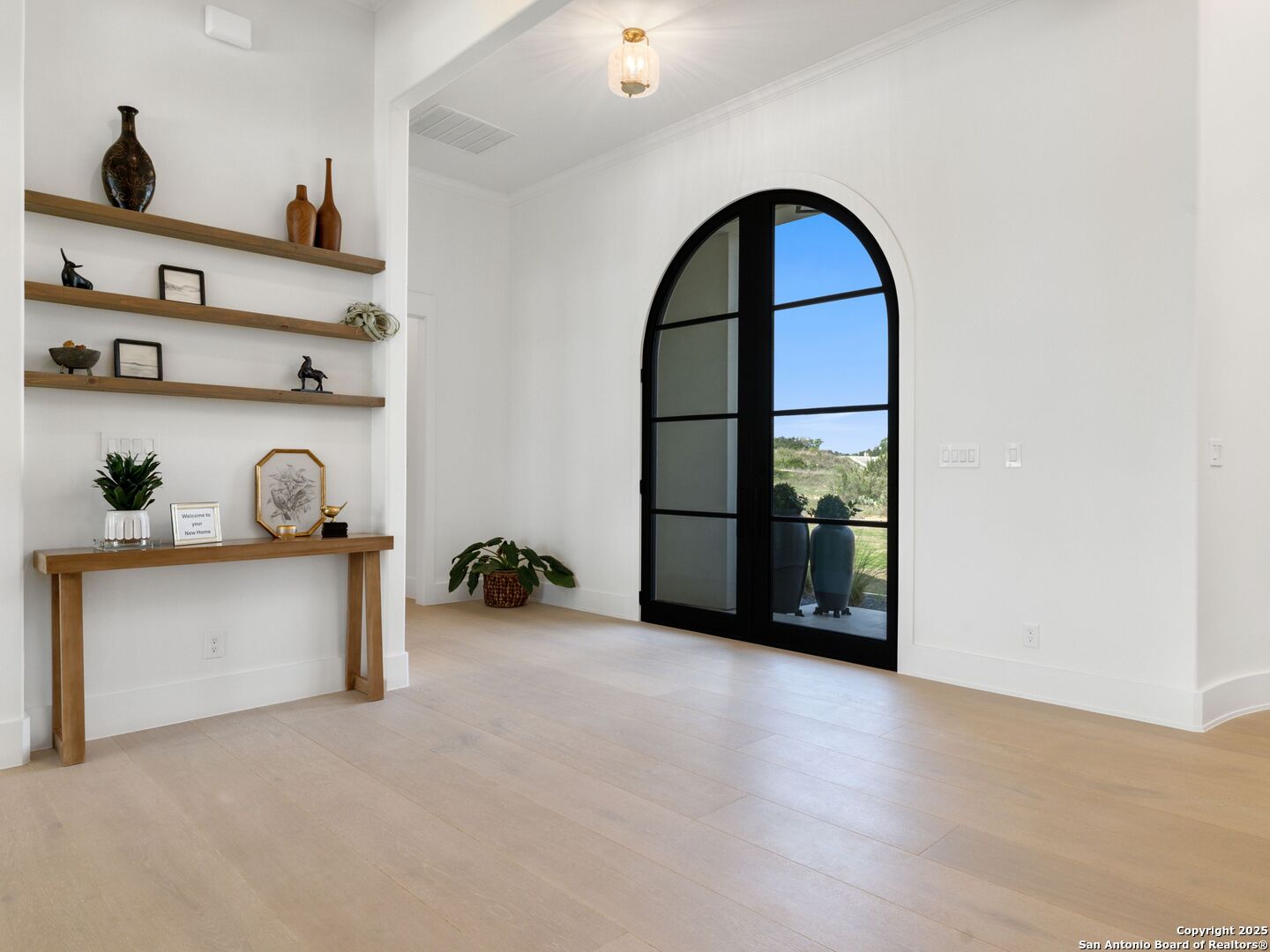 137 Phillip Ranch Road Boerne, TX 78006 - Photo 5 of 61 a view of workspace with a window and shelf