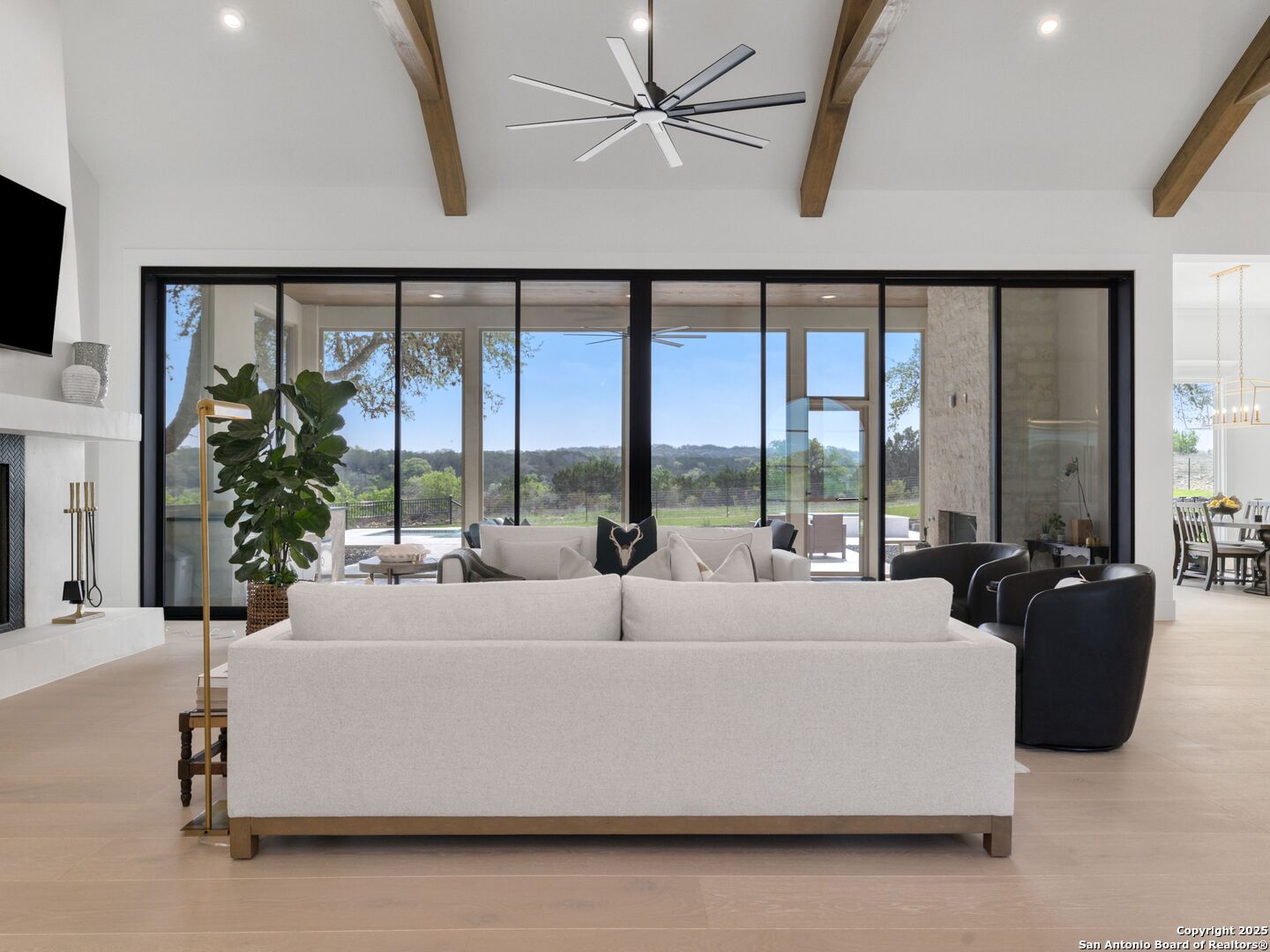 137 Phillip Ranch Road Boerne, TX 78006 - Photo 10 of 61 a living room with furniture and a large window