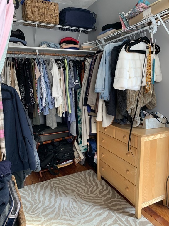 25 Sullivan Street, Unit 3 Boston, MA 02129 - Photo 11 of 13 a view of walk in closet with clothes and shoes