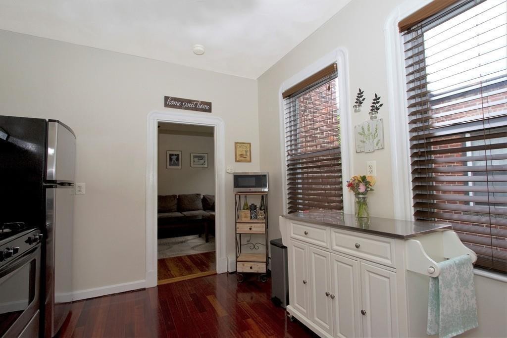 25 Sullivan Street, Unit 3 Boston, MA 02129 - Photo 4 of 13 a kitchen with a refrigerator and a stove