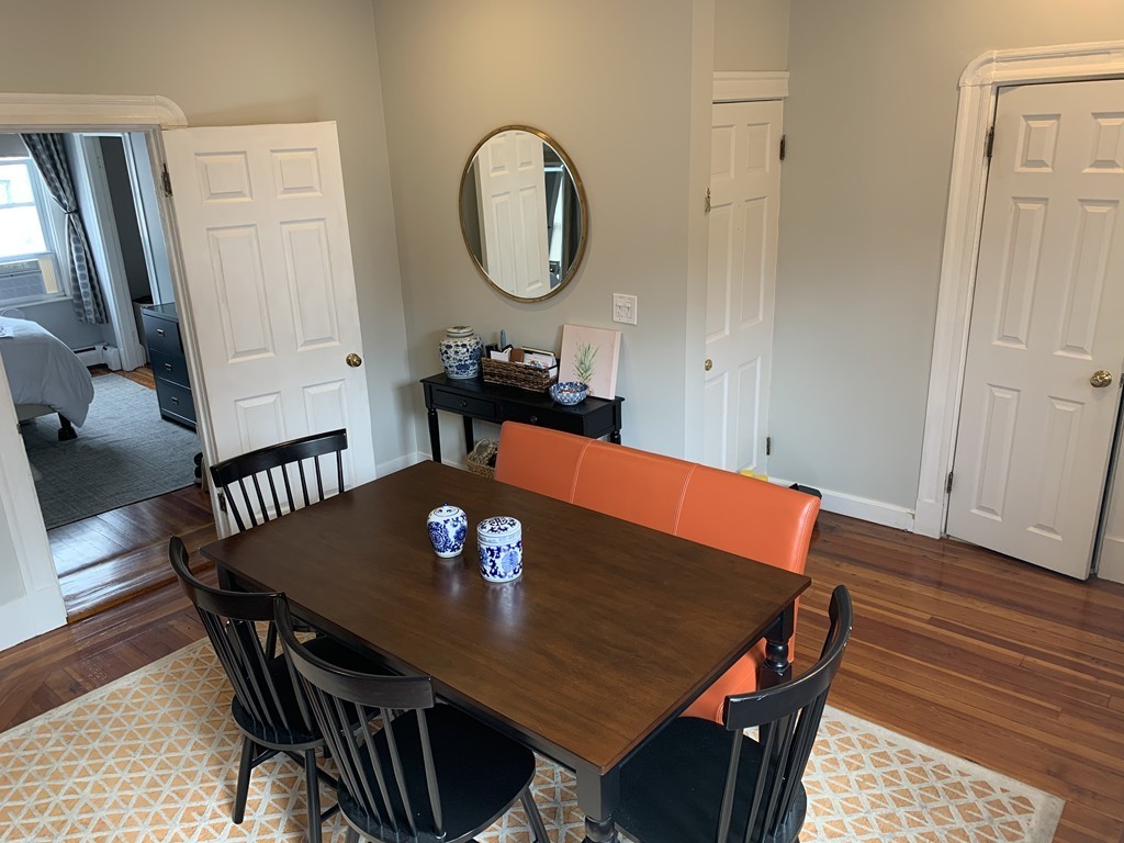 25 Sullivan Street, Unit 3 Boston, MA 02129 - Photo 6 of 13 a view of a dining room with furniture and wooden floor