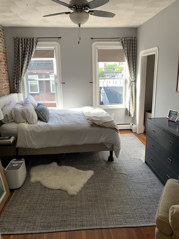 25 Sullivan Street, Unit 3 Boston, MA 02129 - Photo 9 of 13 a bedroom with a bed and window