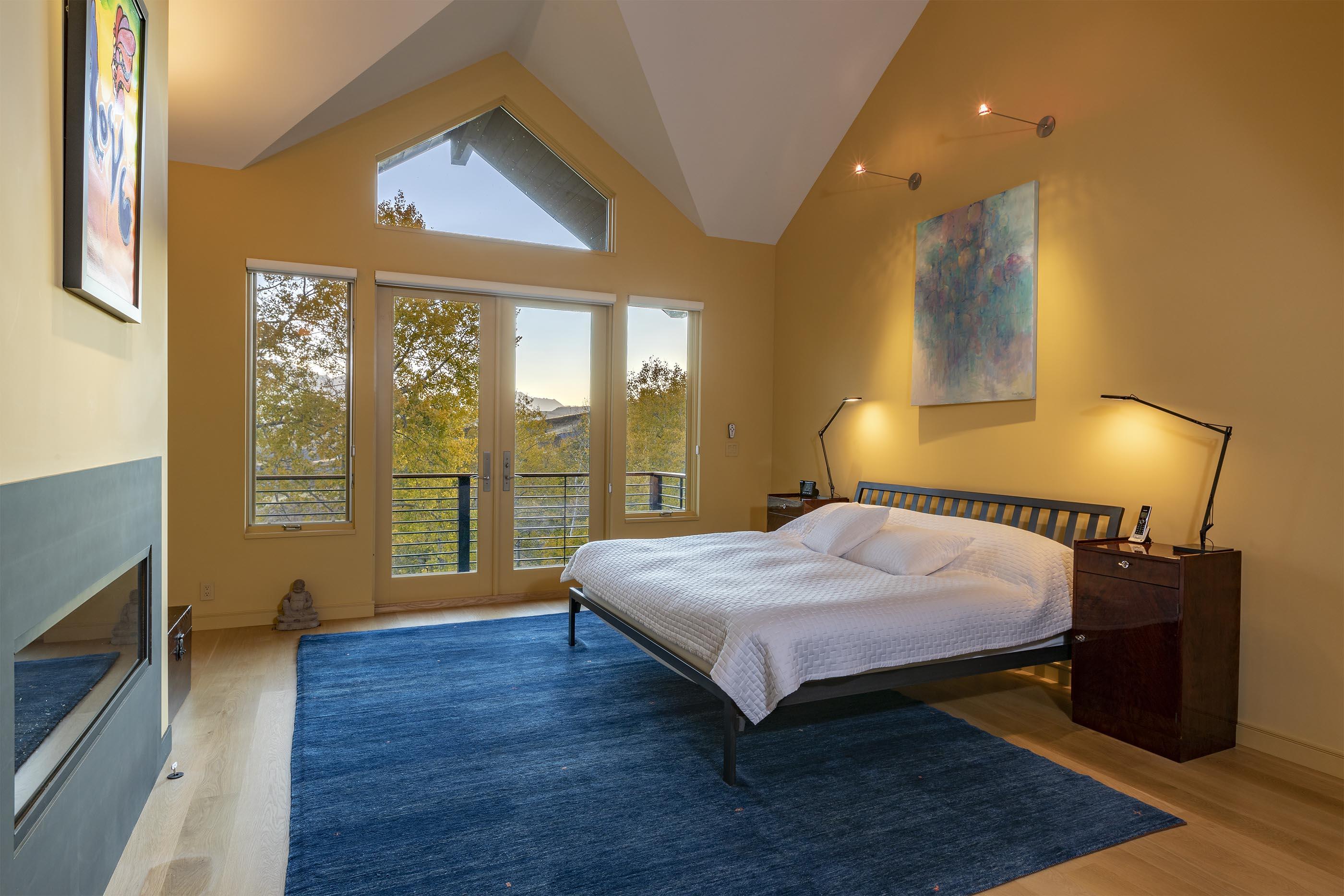 107 Miguel Road Telluride, CO 81435 - Photo 15 of 32 a bedroom with a bed and wooden floor