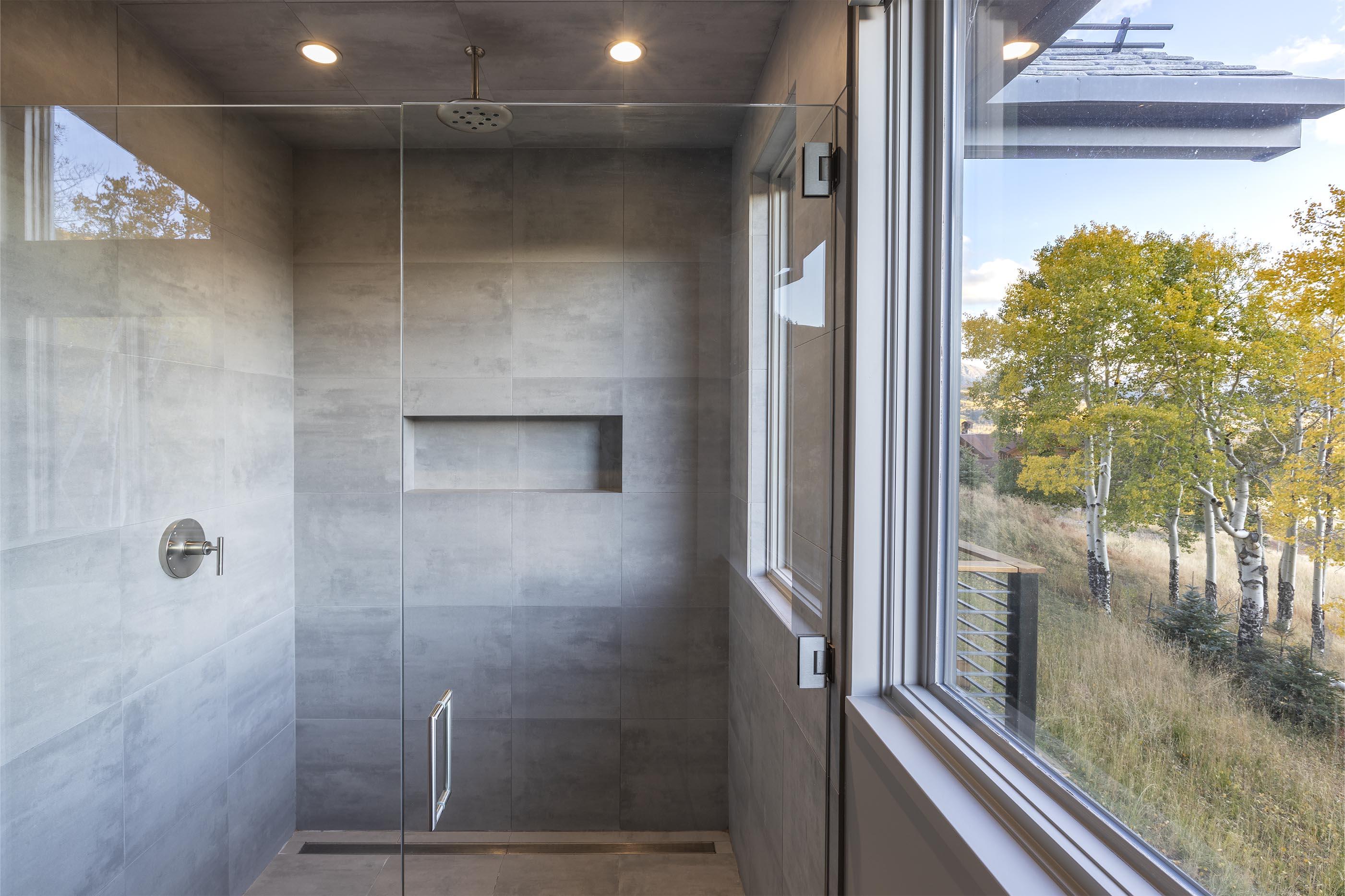 107 Miguel Road Telluride, CO 81435 - Photo 17 of 32 a bathroom with a glass shower door