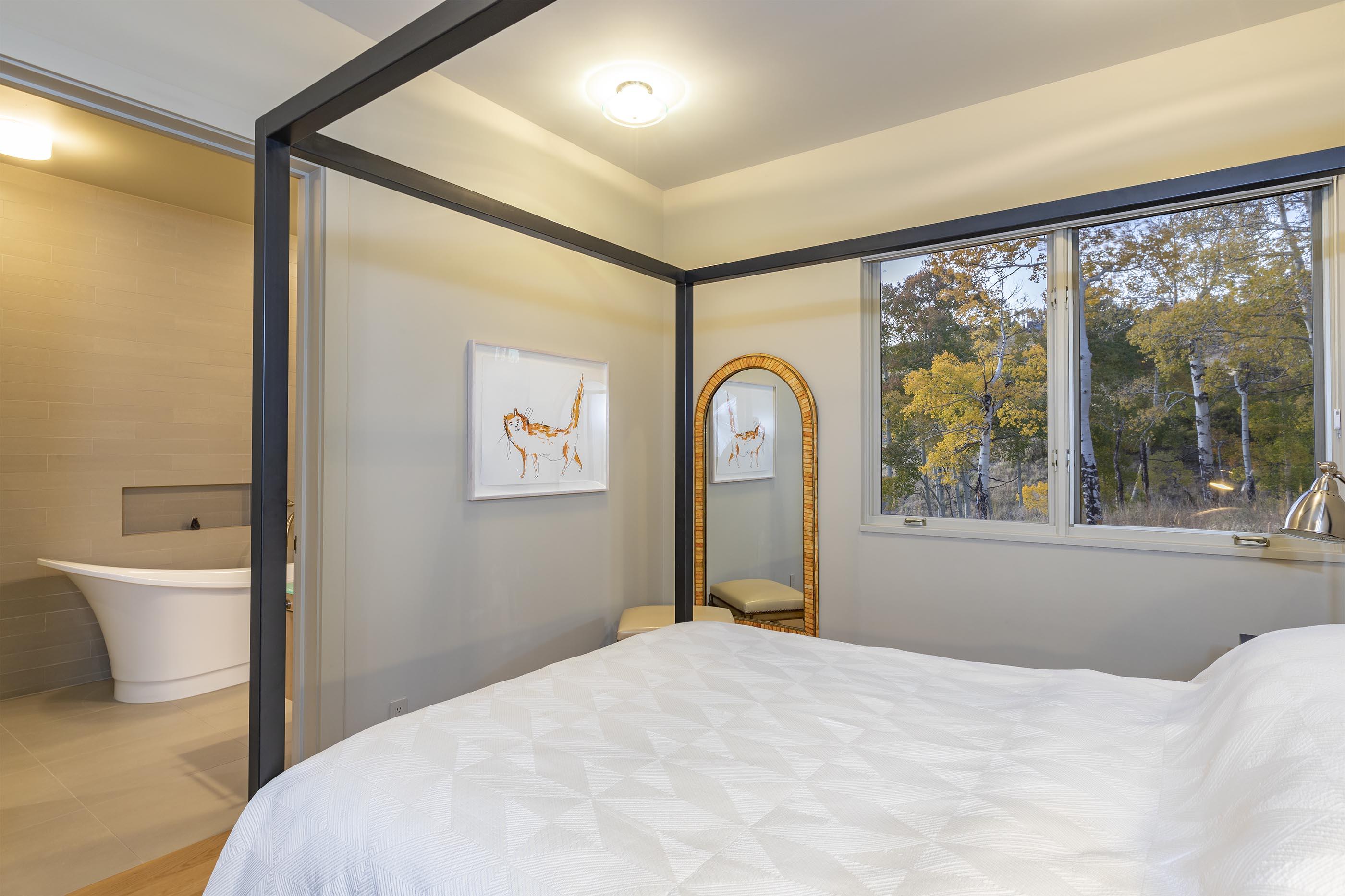 107 Miguel Road Telluride, CO 81435 - Photo 24 of 32 a bedroom with a bed and a large window