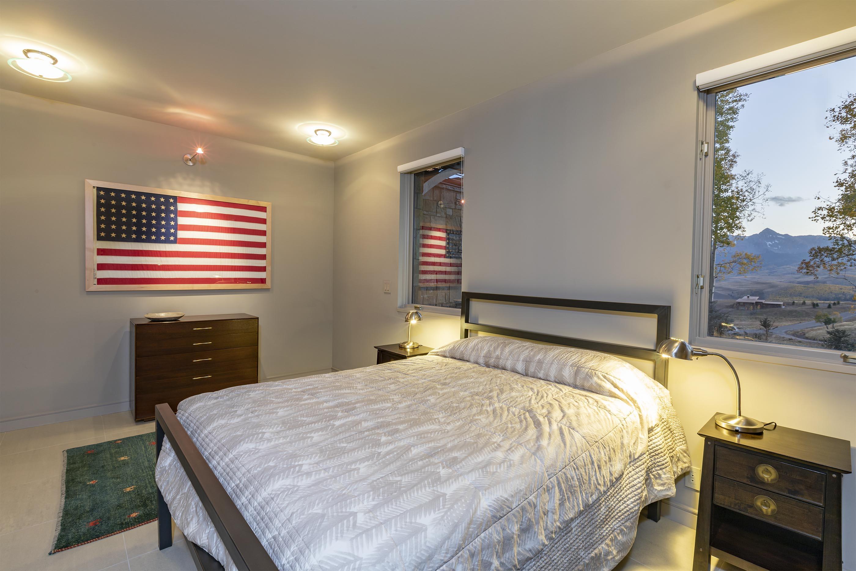 107 Miguel Road Telluride, CO 81435 - Photo 26 of 32 a bedroom with a bed and a mirror