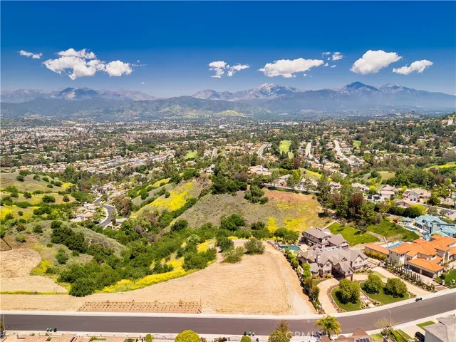 an aerial view of residential houses and outdoor space
