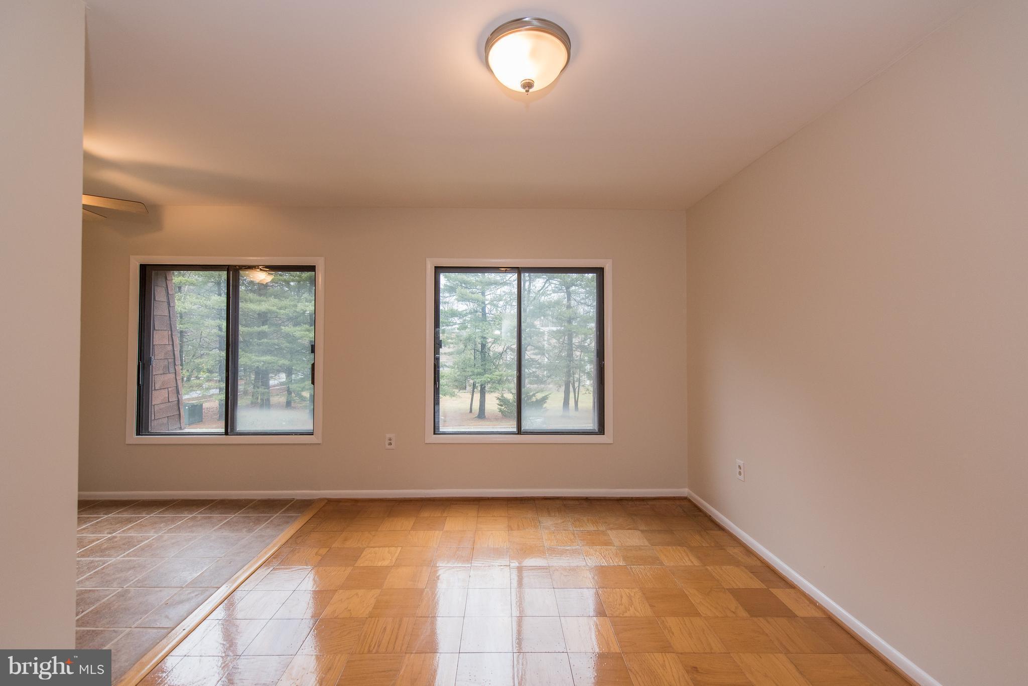 5232 West Running Brook Road, Unit 301 Columbia, MD 21044 - Photo 13 of 29 an empty room with windows