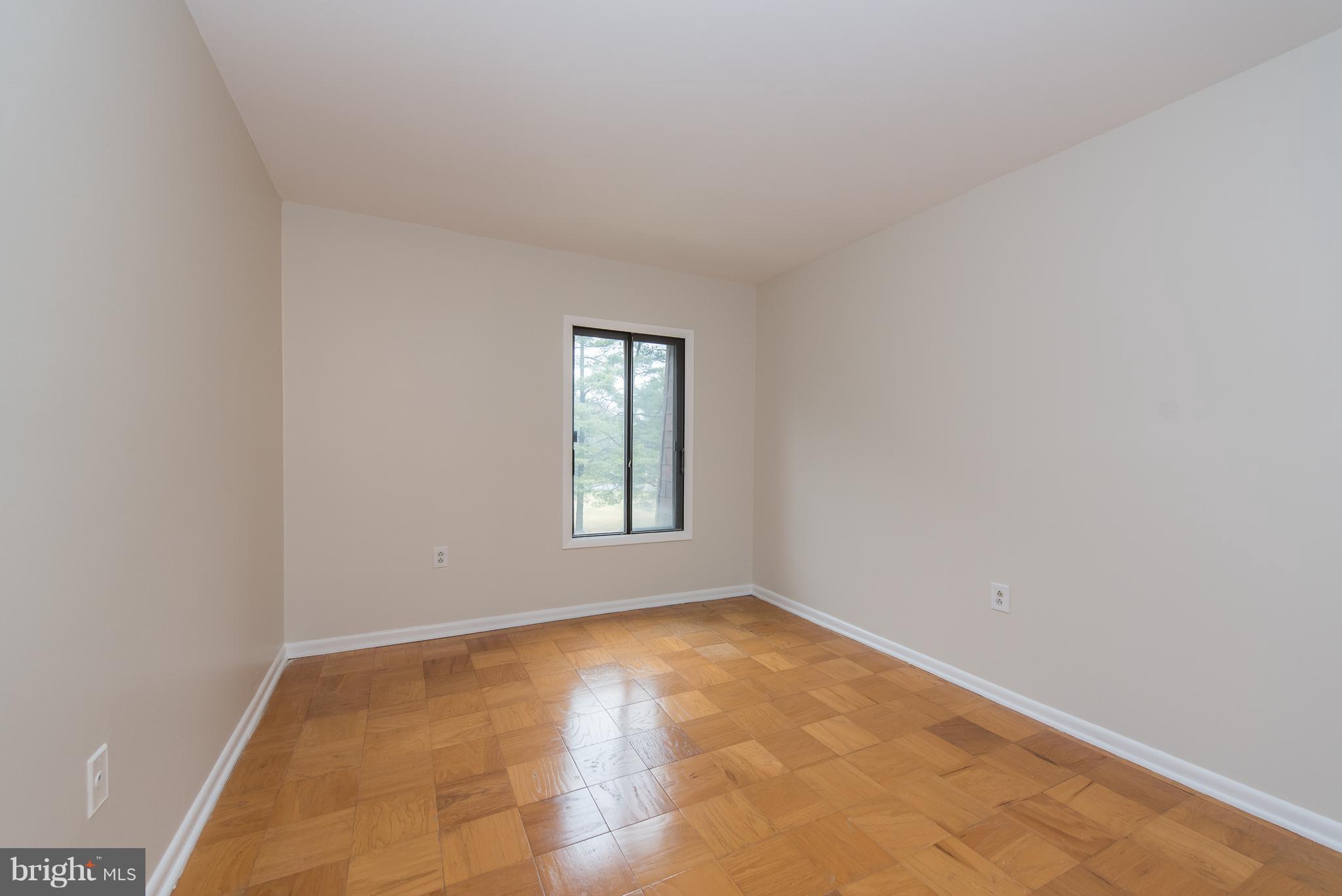 5232 West Running Brook Road, Unit 301 Columbia, MD 21044 - Photo 14 of 29 a view of an empty room with a window