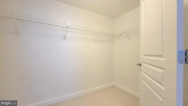 a view of an empty walk in closet