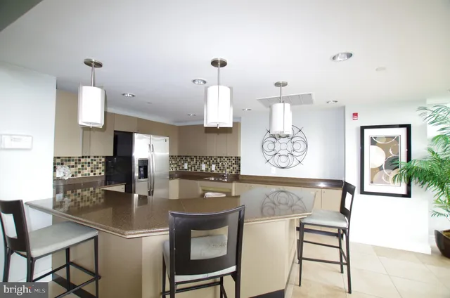 a view of a kitchen with a table and chairs