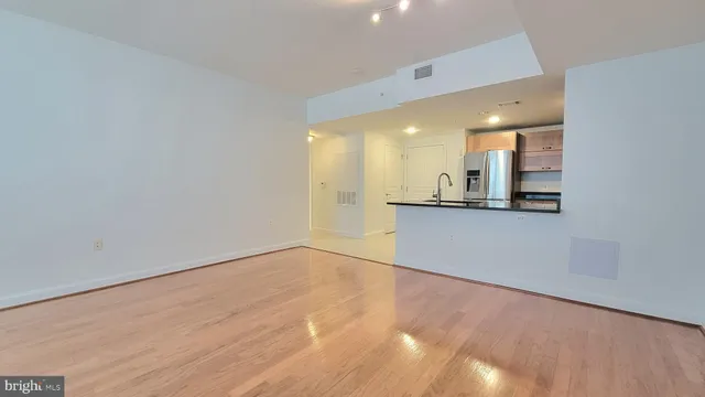 a view of a kitchen with a sink and a window