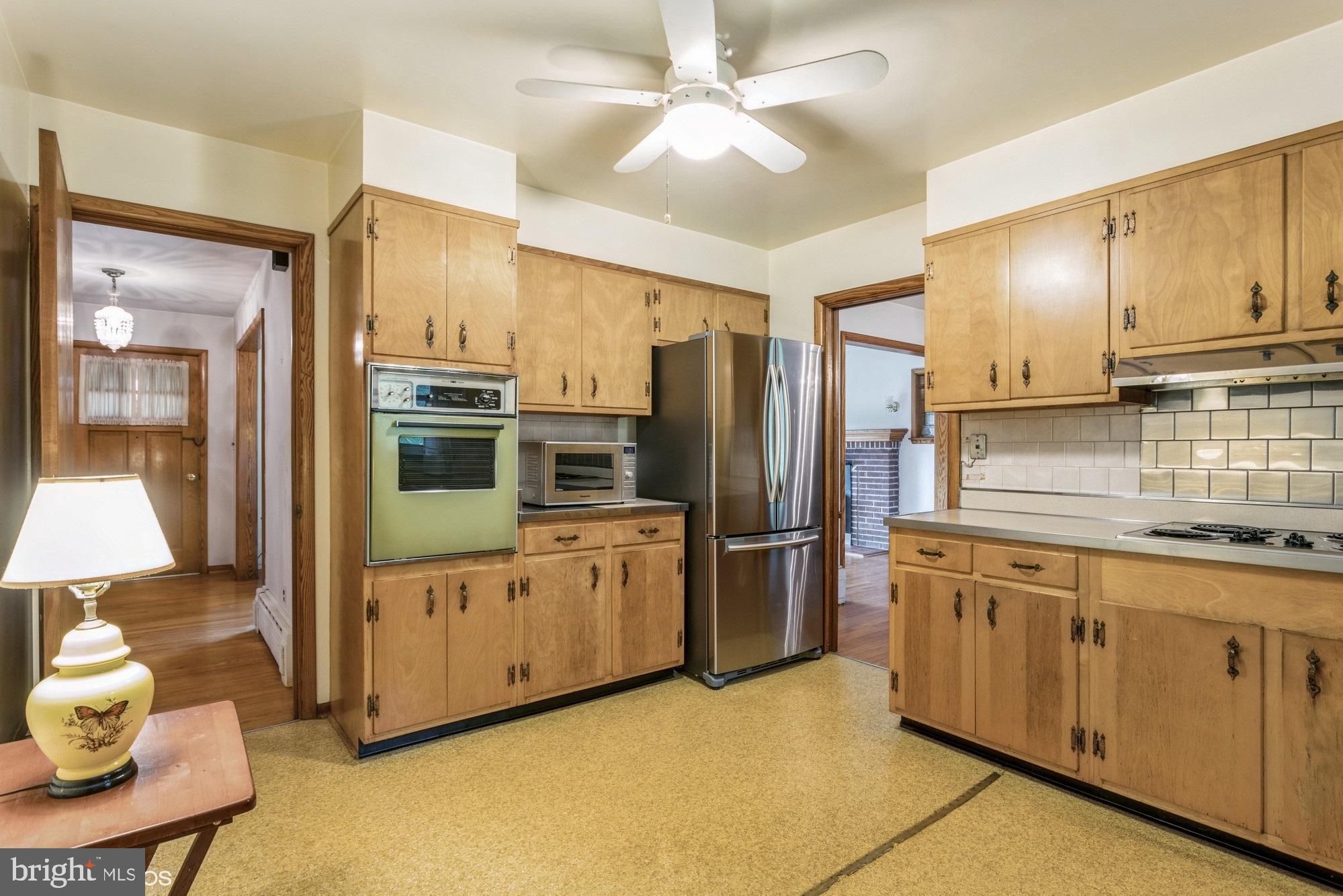 505 Whitaker Mill Road Fallston, MD 21047 - Photo 13 of 49 a kitchen with stainless steel appliances a refrigerator sink and stove