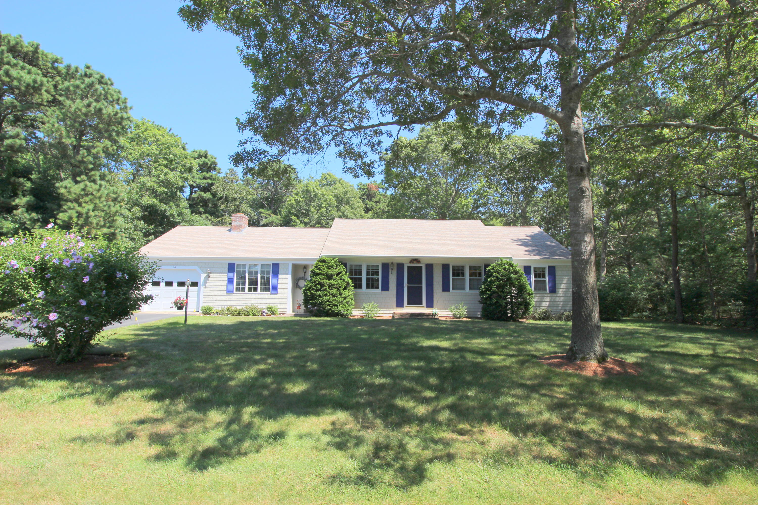 10 Micah Hamlin Road Centerville, MA 02632 - Photo 3 of 35 a front view of a house with a yard