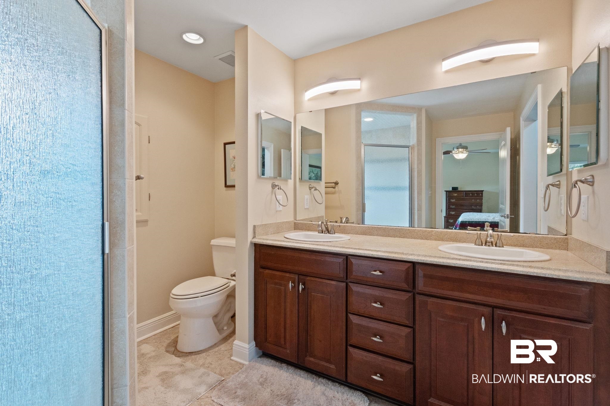 24250 Hack Road Bay Minette, AL 36507 - Photo 29 of 88 Full bath with double vanity, ensuite bathroom, light tile patterned floors, and a shower